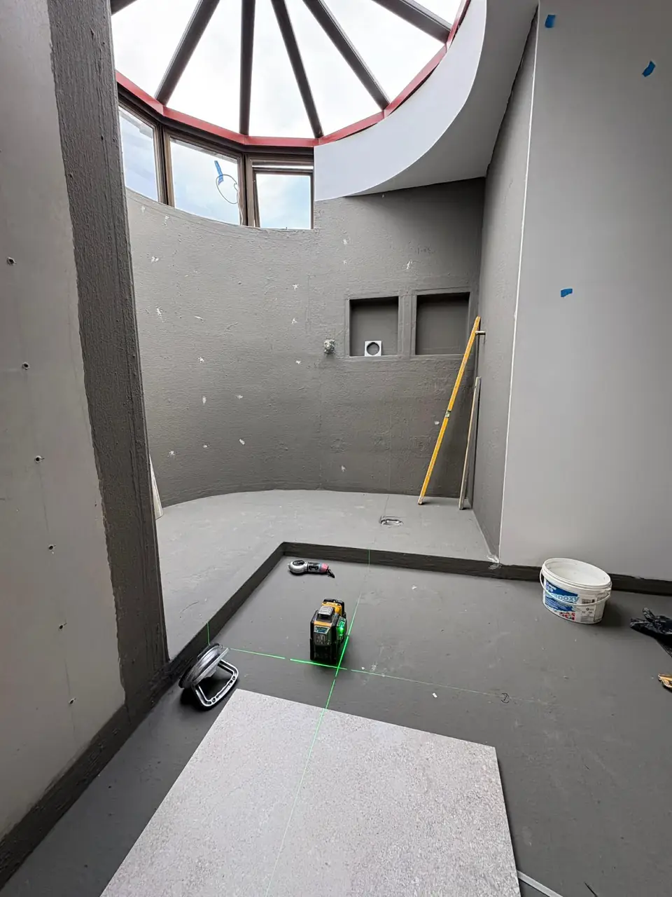 Curved shower wall lined and prepped for tiling