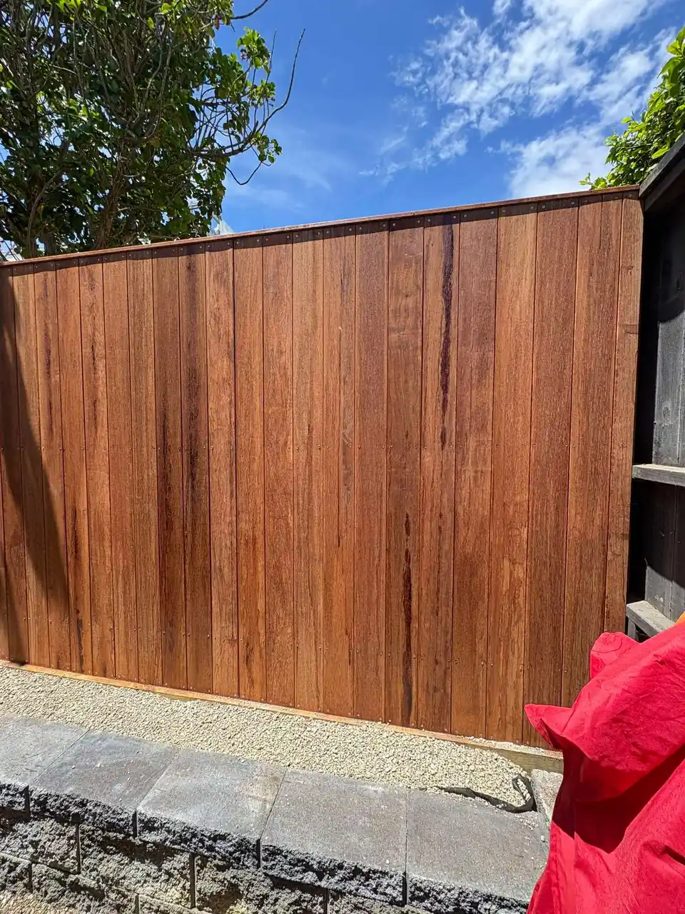 Close vertical hardwood fence boards