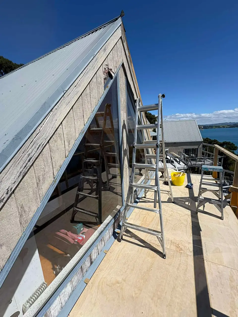 A-frame bach with scaffold and new cladding going on