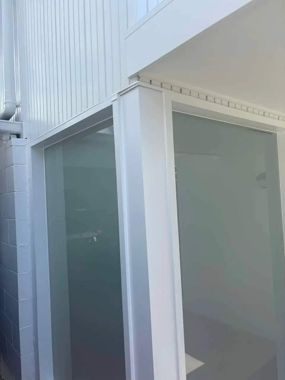 Repaired joinery and cladding, painted white