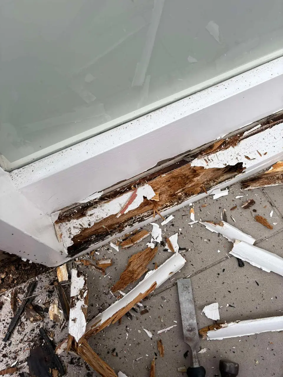 Decayed sill timber being cut out