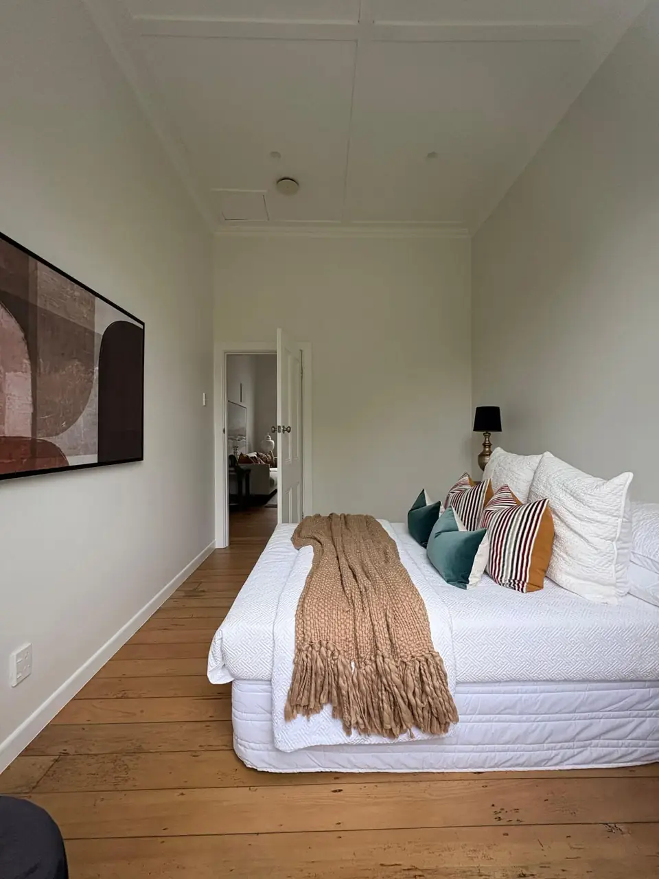 Freshly renovated villa bedroom with timber floors