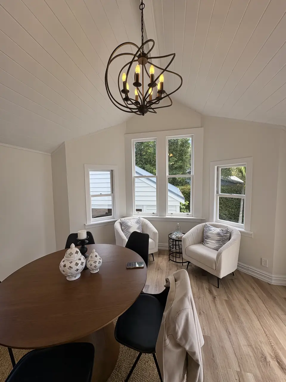 Villa dining room with bay windows and a high stud ceiling