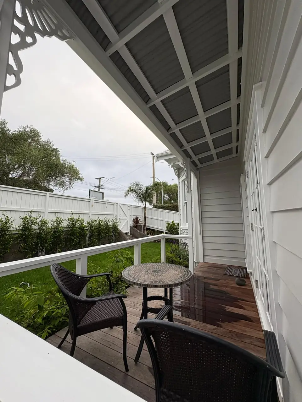 Covered villa verandah with timber decking and outdoor seating
